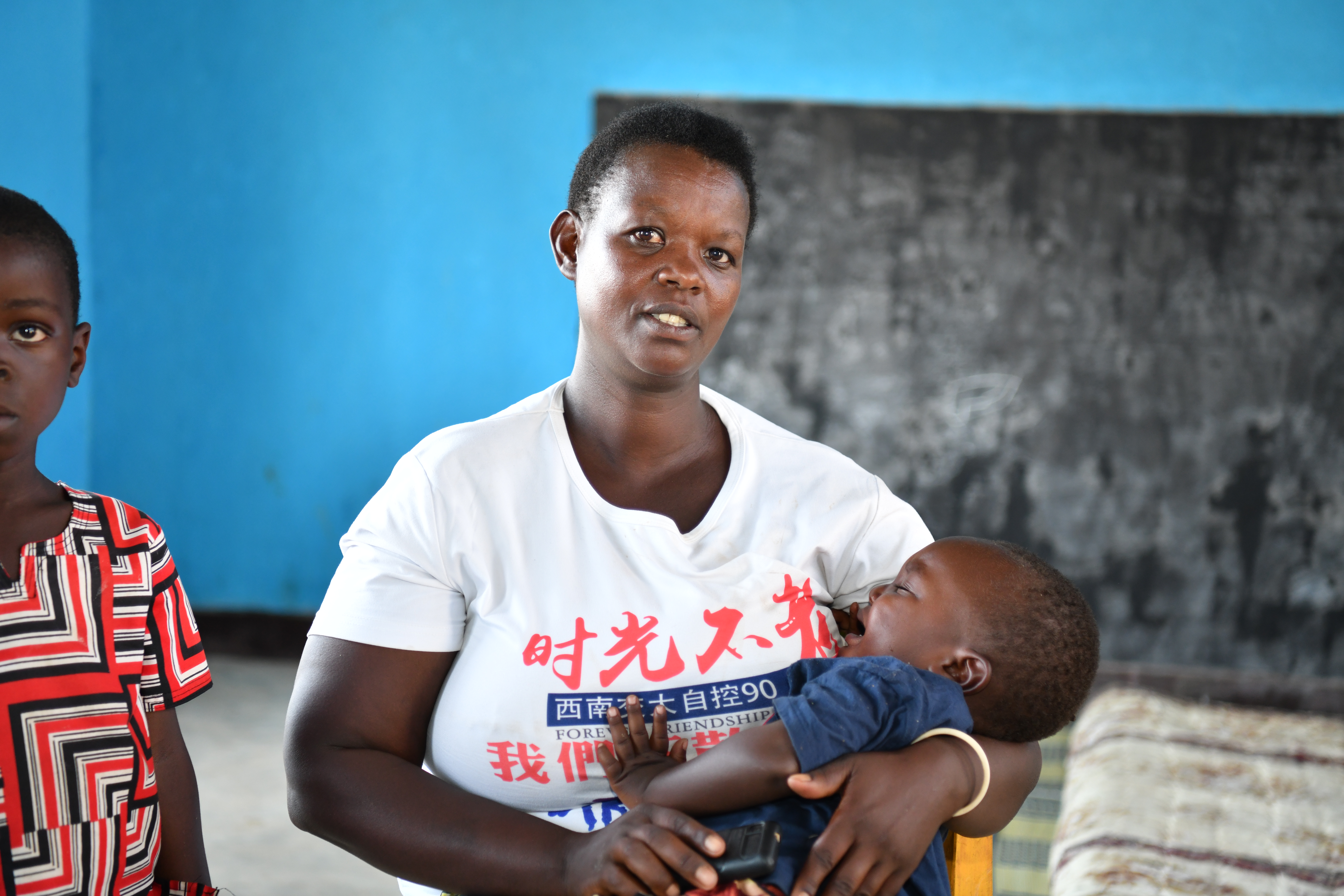 Christine Mukamana with her youngest son at the ECD in Munini Sector, Nyaruguru District, Rwanda.