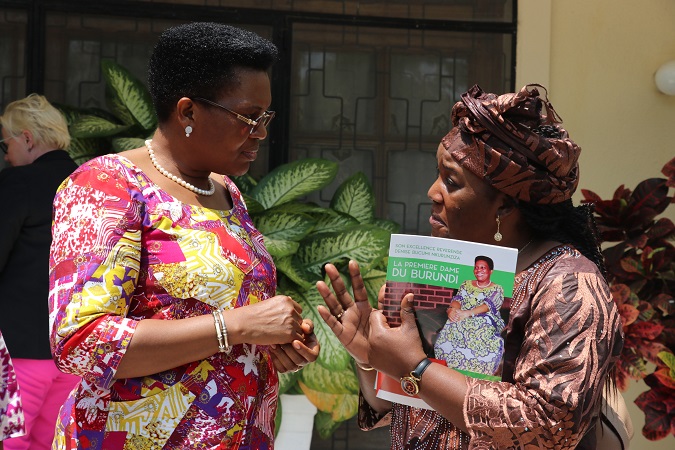 Arlette Mvondo from UN Women Burundi Country Office shares a moment with First Lady Denise Nkurunziza during the visit to her office in Bujumbura. Photo: UN Women/ Faith Bwibo