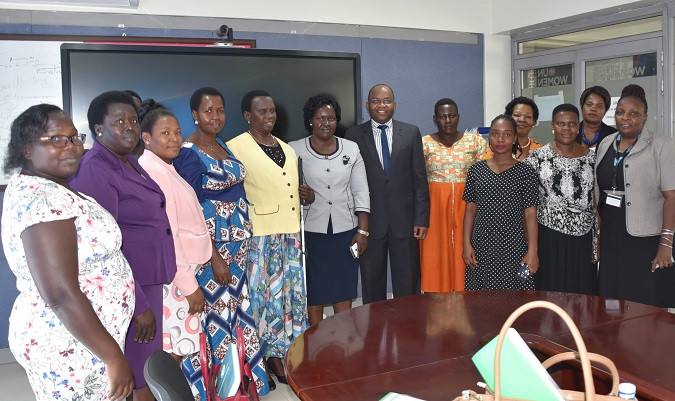 Dr. Maxime Houinato, UN Women Country Representative (Middle) with Executive members of the Uganda Women Parliamentary Association (UWOPA)