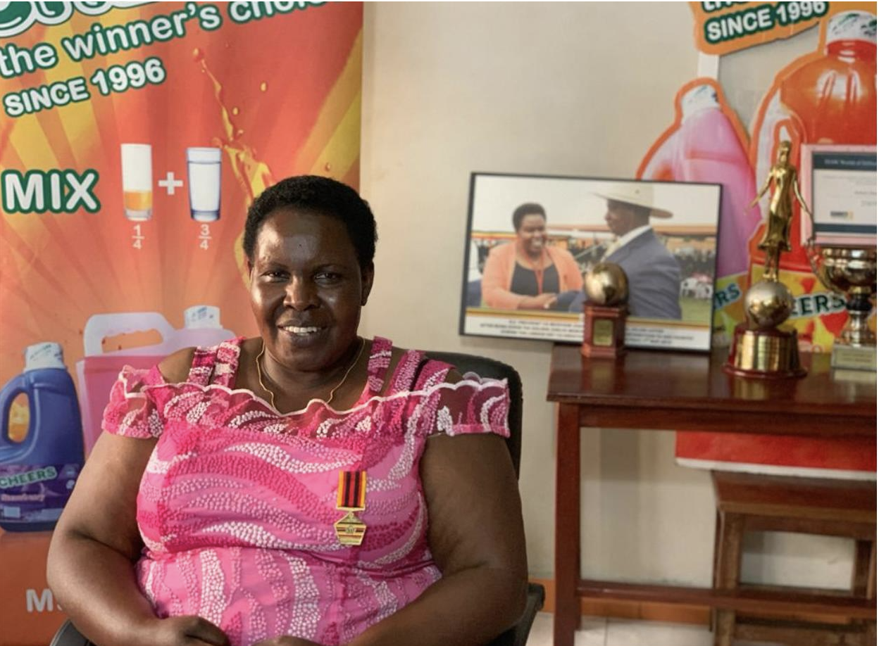Dr. Julian Adyeri sitting in her office among her accolades and awards at Delight Uganda Ltd Headquarters. Photo courtesy of Dr. Julian Adyeri