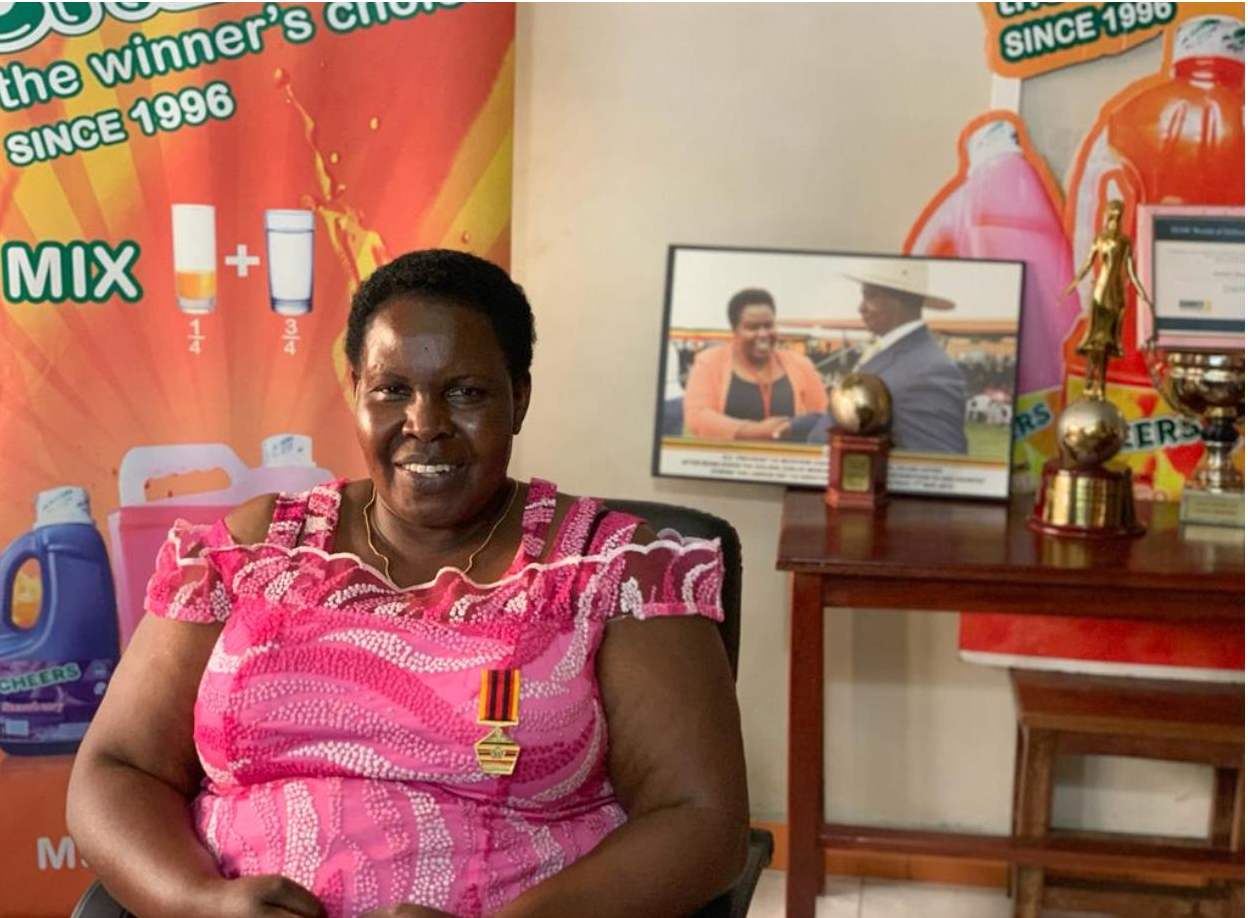 Dr. Julian Adyeri sitting in her office among her accolades and awards at Delight Uganda Ltd Headquarters. Photo courtesy of Dr. Julian Adyeri