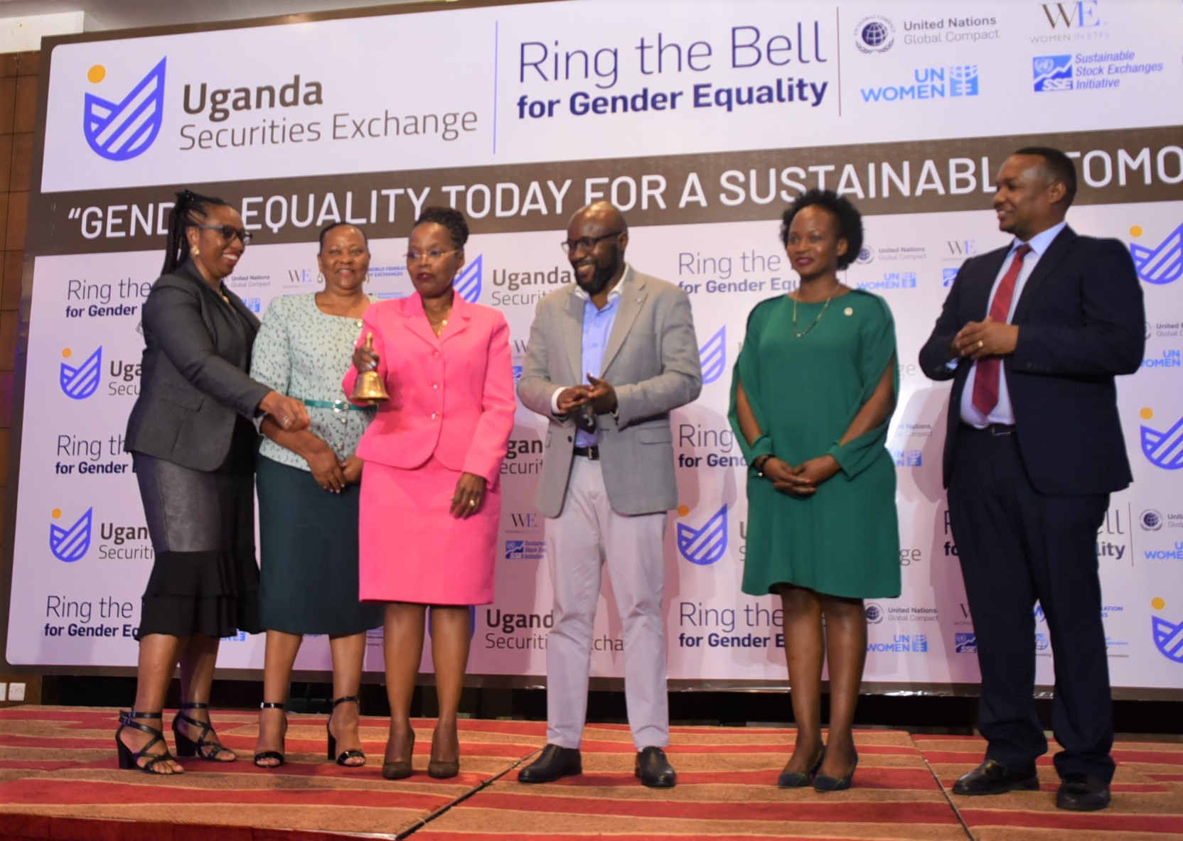 (UN Women Deputy Country Representative, ) stands alongside private sector representatives in Uganda