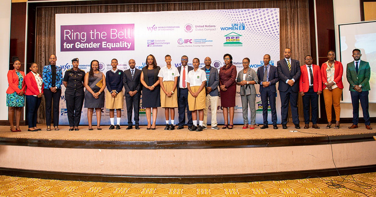 Delegates at the ‘Ring the Bell’ event pose for a group photo after the “Ring the Bell” event