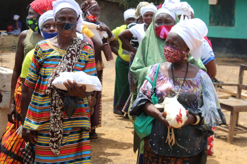 Traditional practitioners from Grand Cape Mount County, in western Liberia welcome the UN Women Spotlight team during a field visit 