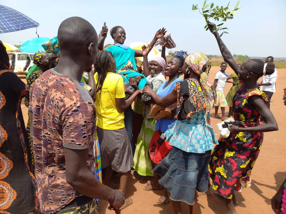 Refugee women celebrate elected Vice Chair Jackline Liong in Bidibidi