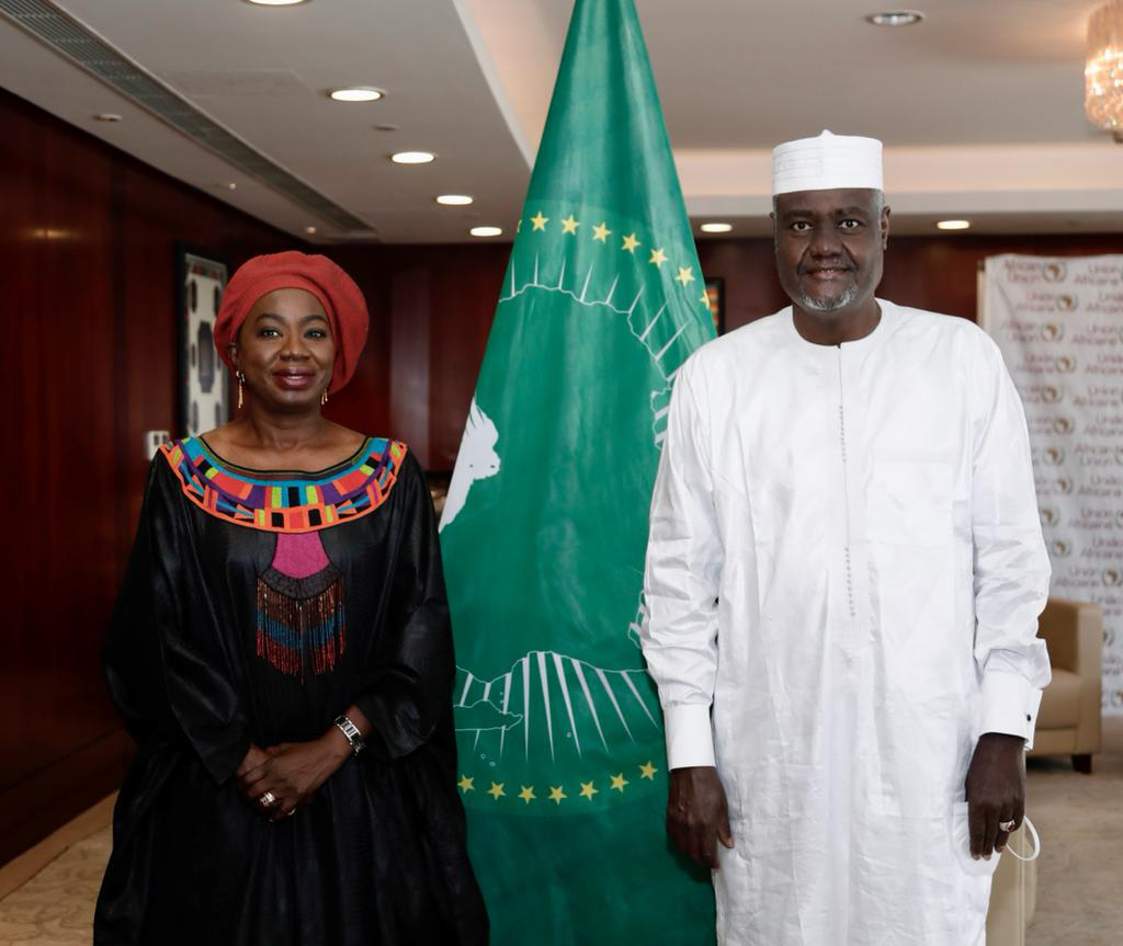 Ms. Awa Ndiaye Seck hands out appointment letter to Chairperson of the AU Commission, H.E. Moussa Faki Mahamat. Photo: Courtesy of AUC.