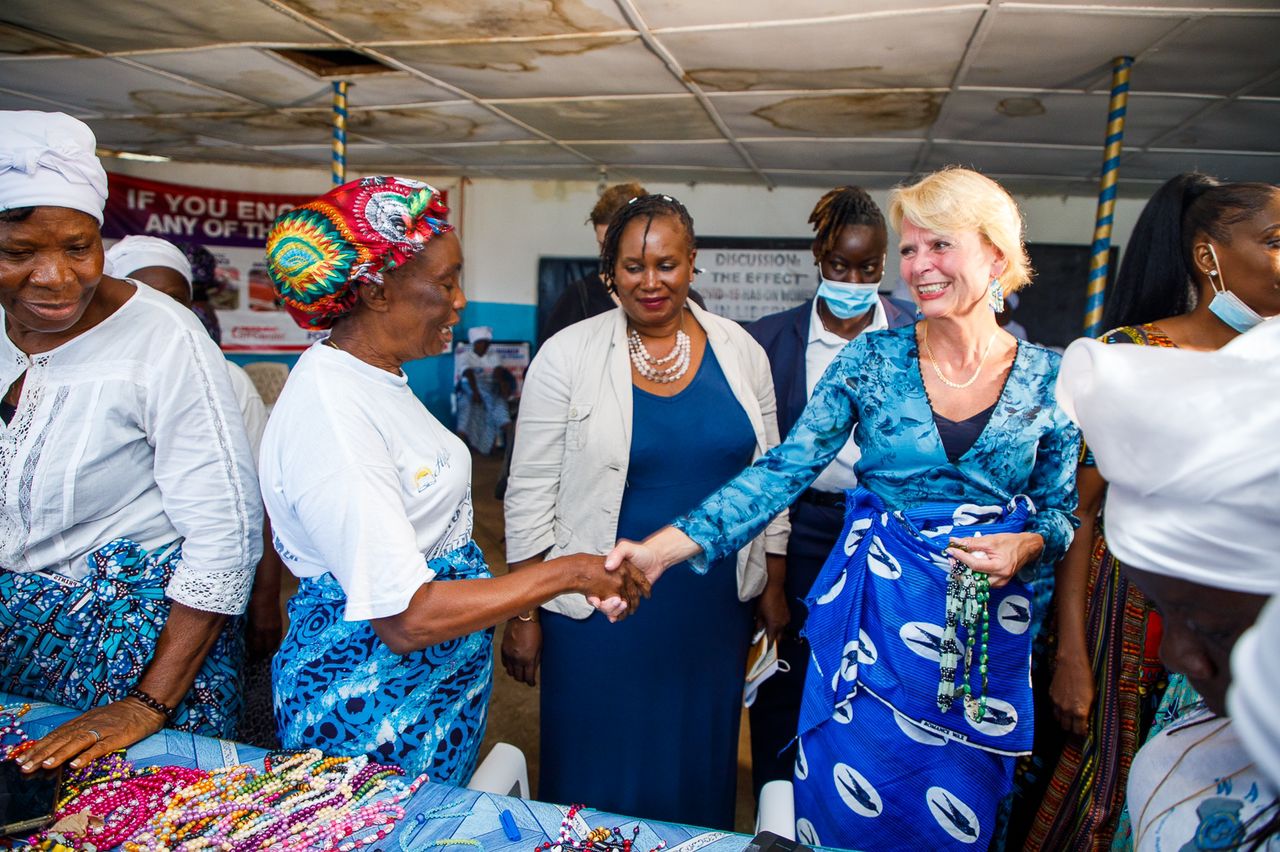 Assistant Secretary General of the United Nations and Deputy Executive Director of UN Women, Asa Regner interacts with members of the Fish market women's Peace Hut in Liberia.