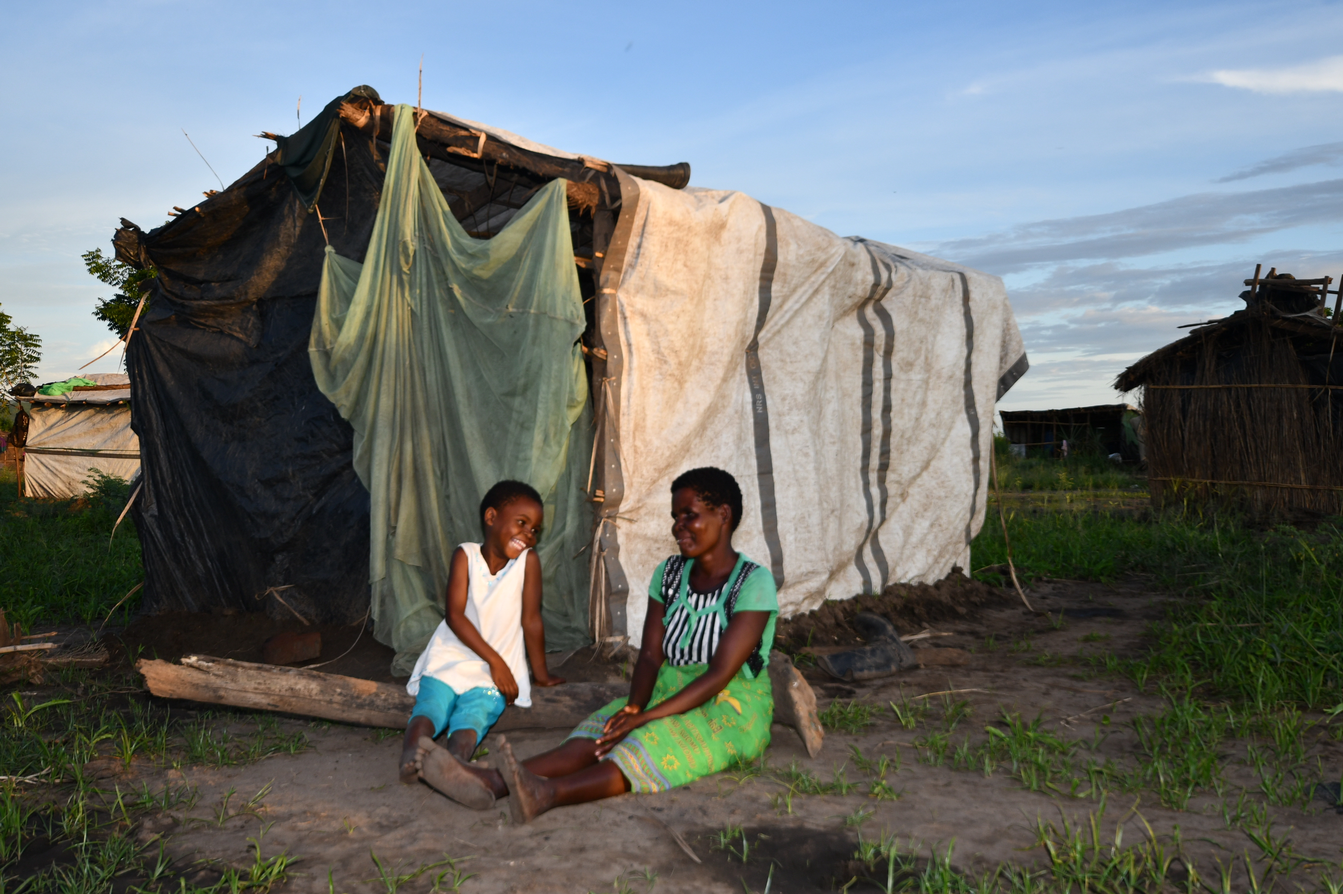 Everson and Lucia in front of their makeshift house in Gambatula Camp in Chikwawa. Photo: UN Women Malawi. 