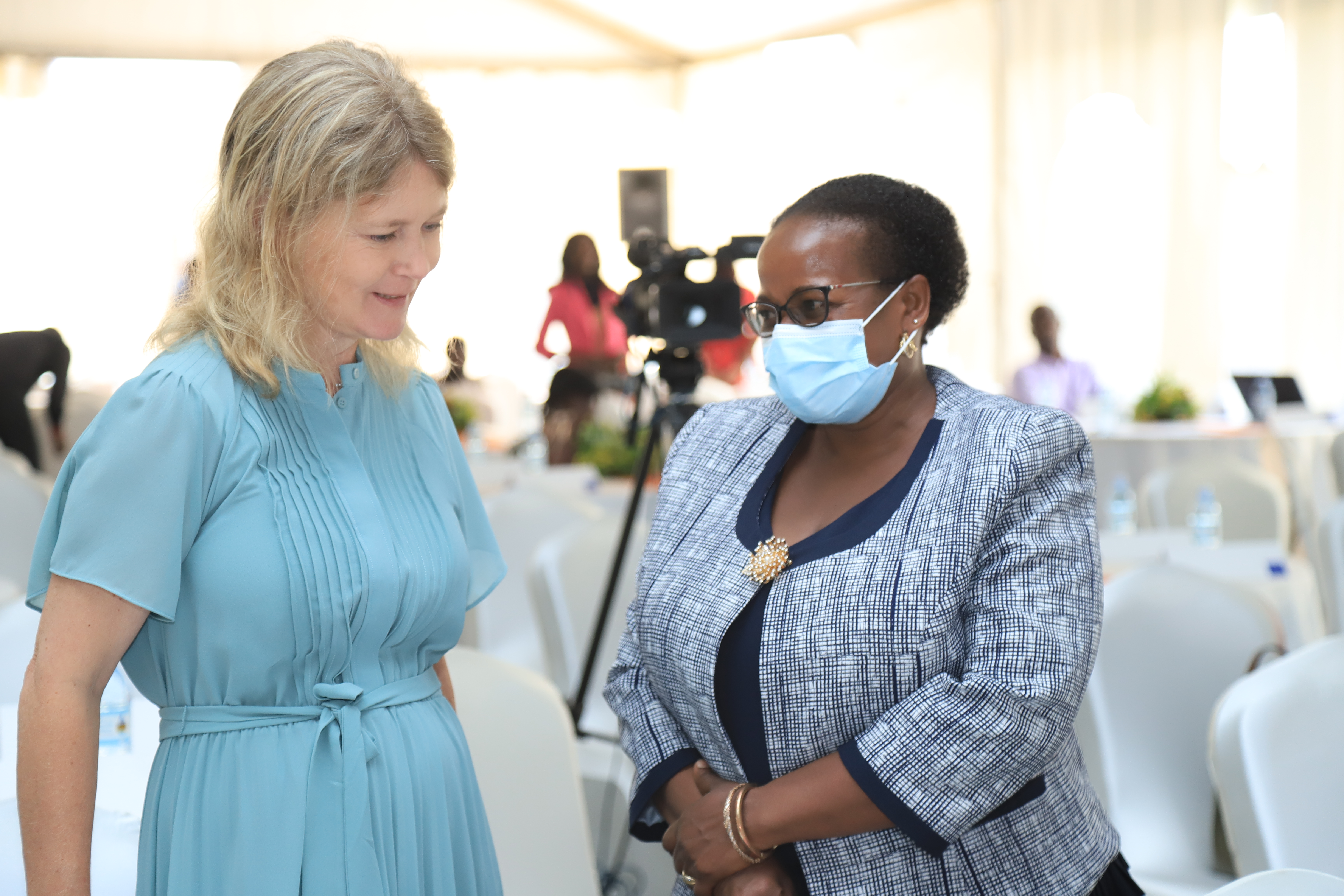 HE The Ambassador of Sweden in Uganda, Maria Hakansson,(left)  in conversation with Commissioner Angela Nakafeero (MGLSD) at the National Symposium 