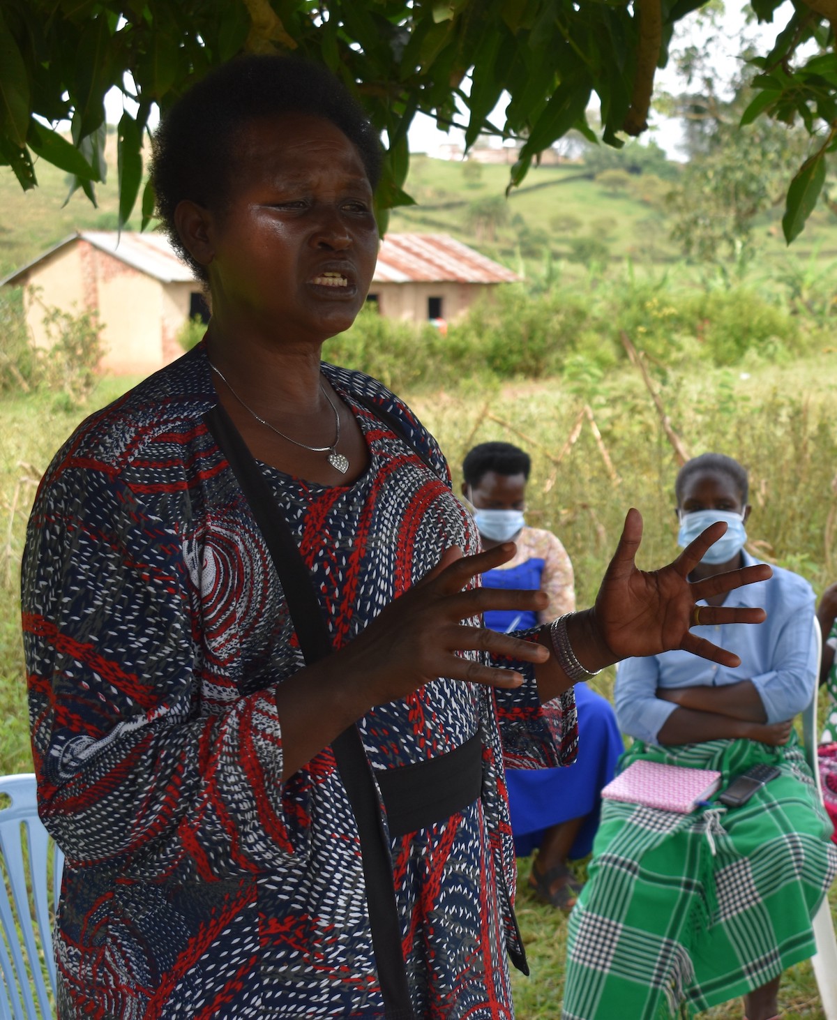 Jolly, speaking to women in her community on peace building and mediation. Photo credit: CoACT