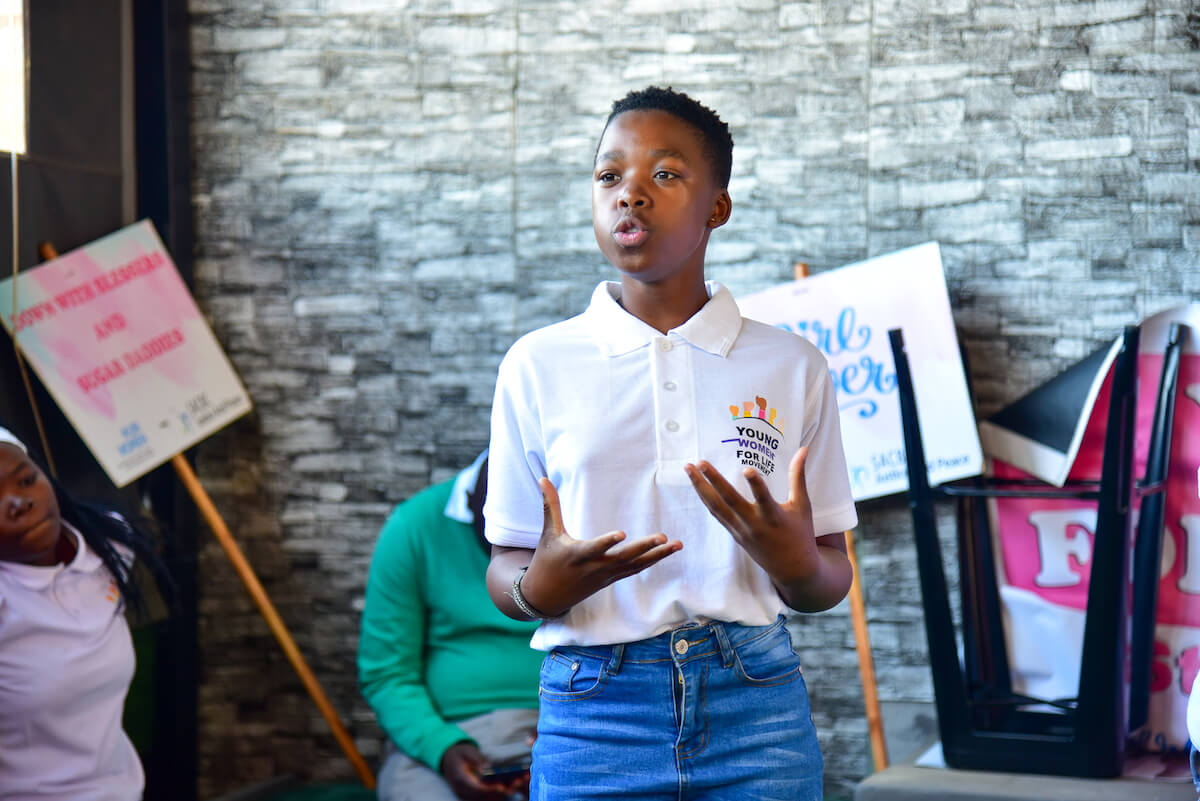 A Young Women for Life member reporting on what her group discussed. Photo: UN Women/James Ochweri