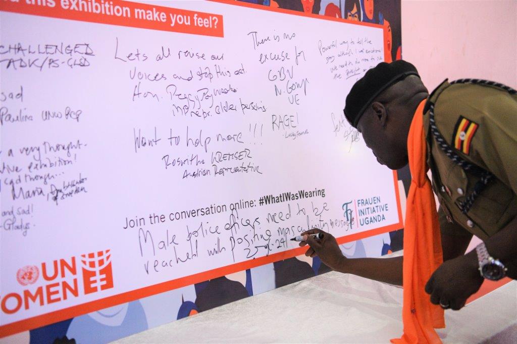 Police Officer Francis Ogweng shares feedback to the "What I Was Wearing" Exhibition at the National Launch (Eva Sibanda/UN Women)