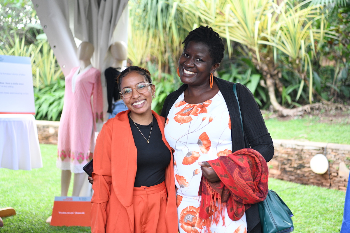 Safina Virani poses for an image with one of the exhibition viewers at the Women Leaders Networking Evening on 22 November 2022 (UN Women/Eva Sibanda)