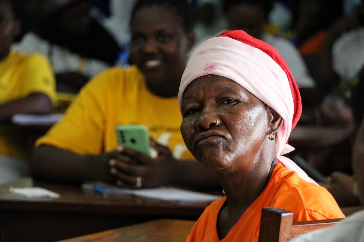 A woman affected by conflict listens attentively to Disarmament, Demobilization, and Reintegration (DDR) presentation, Pemba- Cabo Delgado. (Photo: UN Women / Celma Costa)