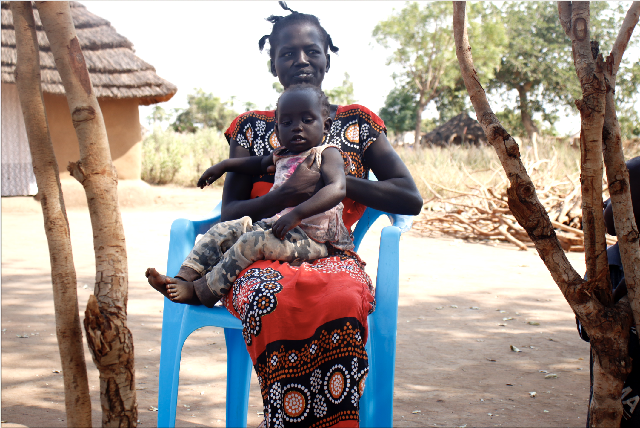 Tabitha with her baby. After overcoming the mental distress, Tabitha is now able to take good care for her children. Photo Credit: TPO Uganda