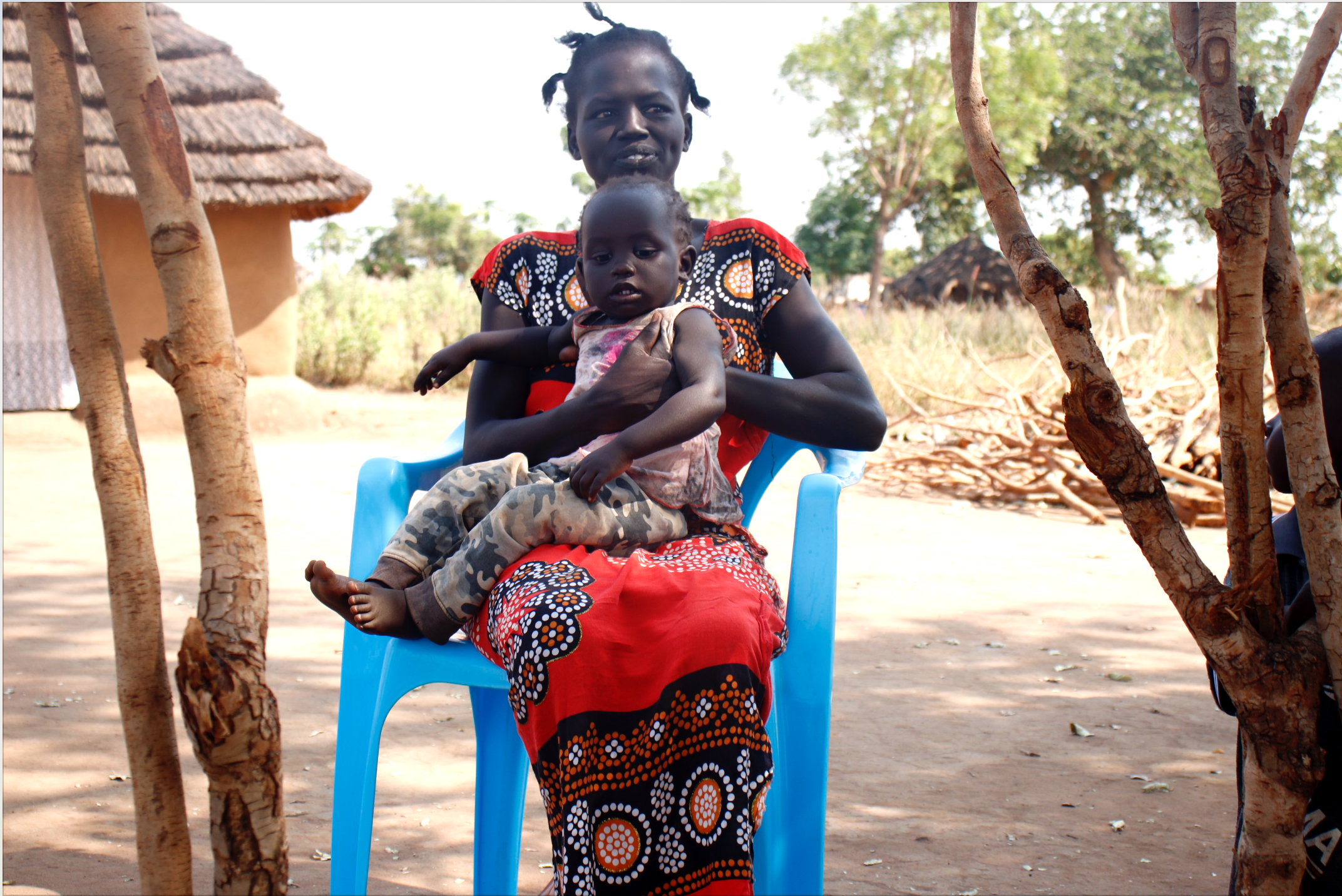 Tabitha with her baby. After overcoming the mental distress, Tabitha is now able to take good care for her children. Photo Credit: TPO Uganda