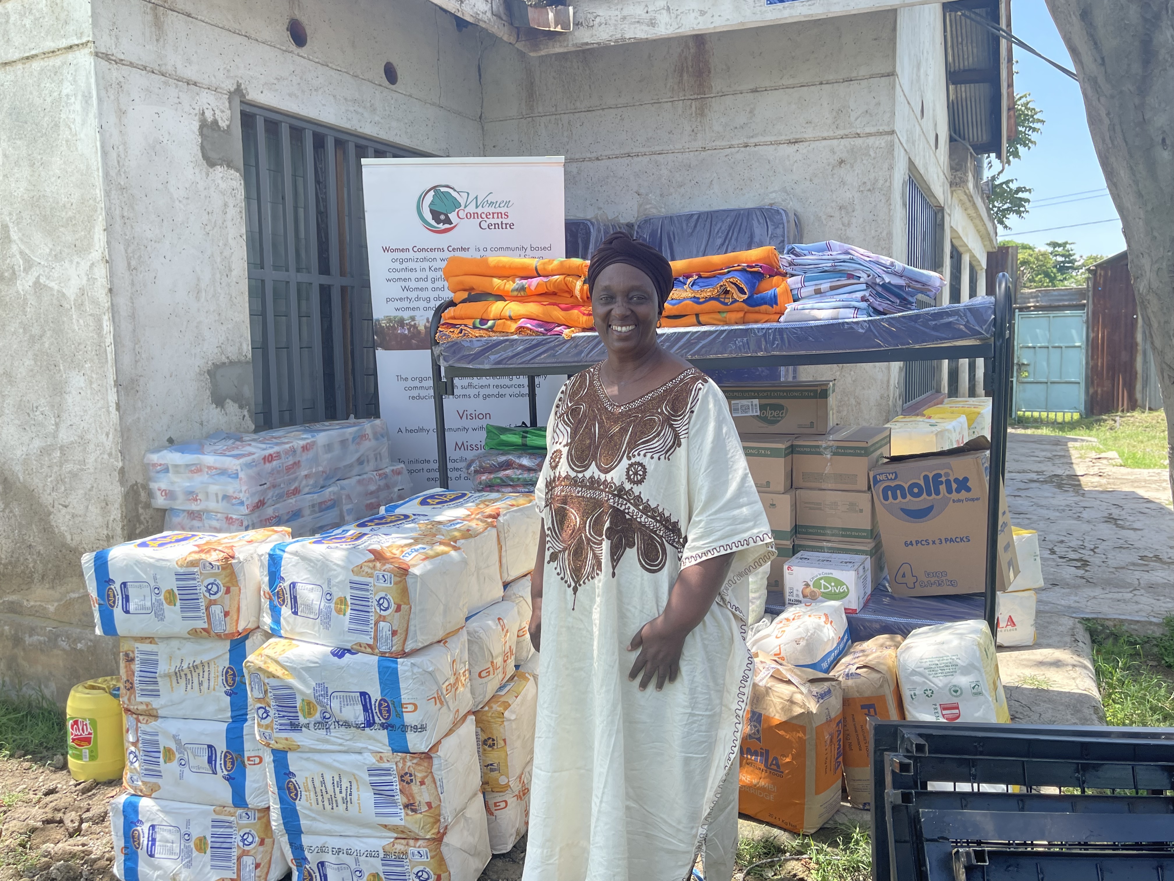 Margaret Mbira, received essential commodities from UN Women to support the Women Concern Centre Shelter in Kisumu. Photo: UN Women/Tabitha Icuga