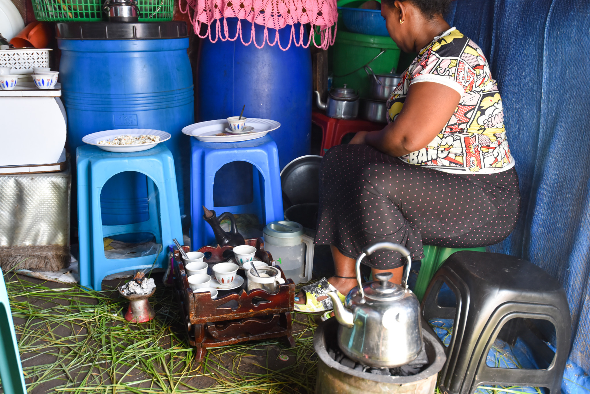 Almaz prepares the traditional coffee to serve her customers.