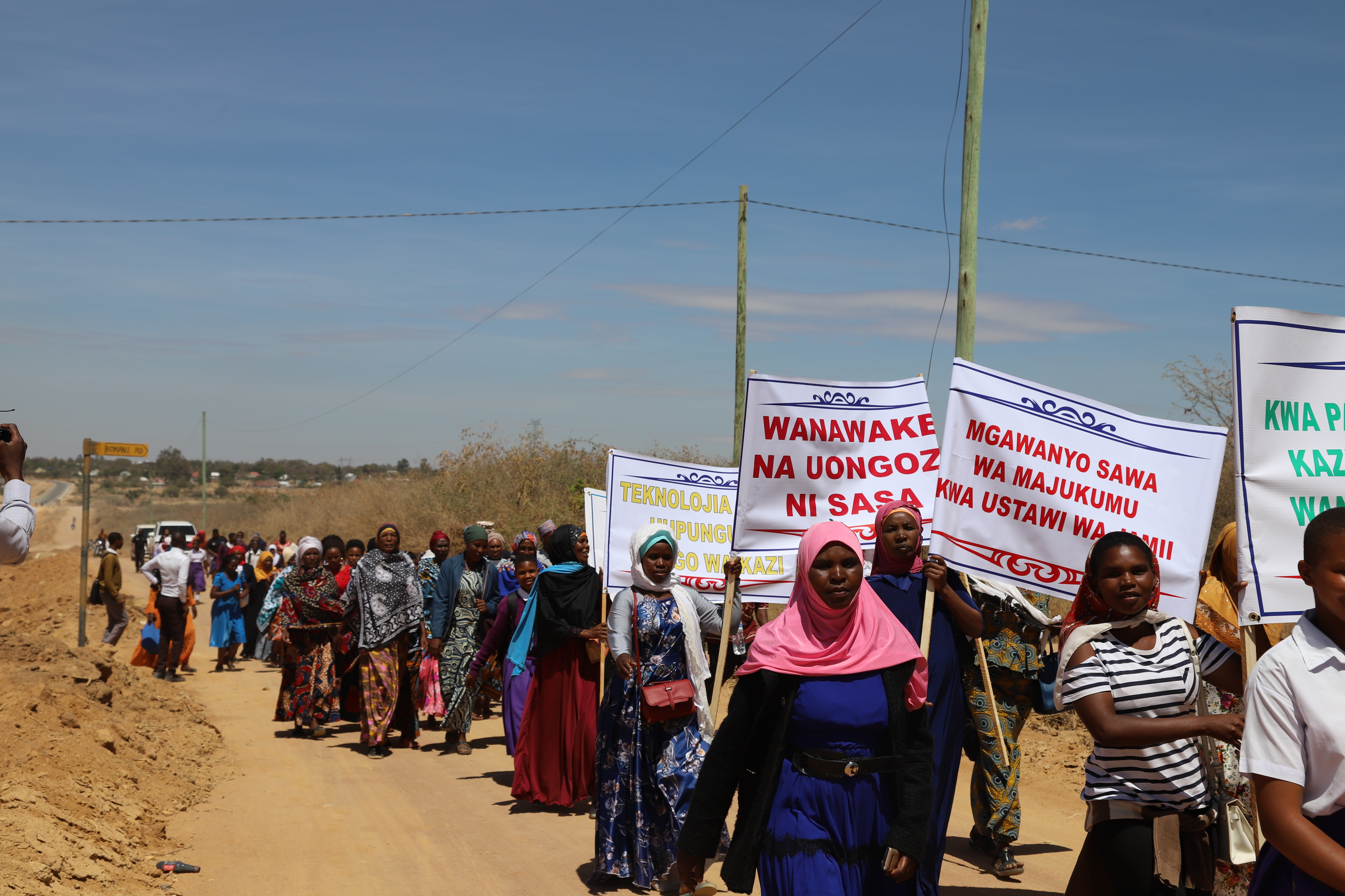 Women marching in the Singida region of Tanzania as a part of celebrations for the International Day of Care and Support