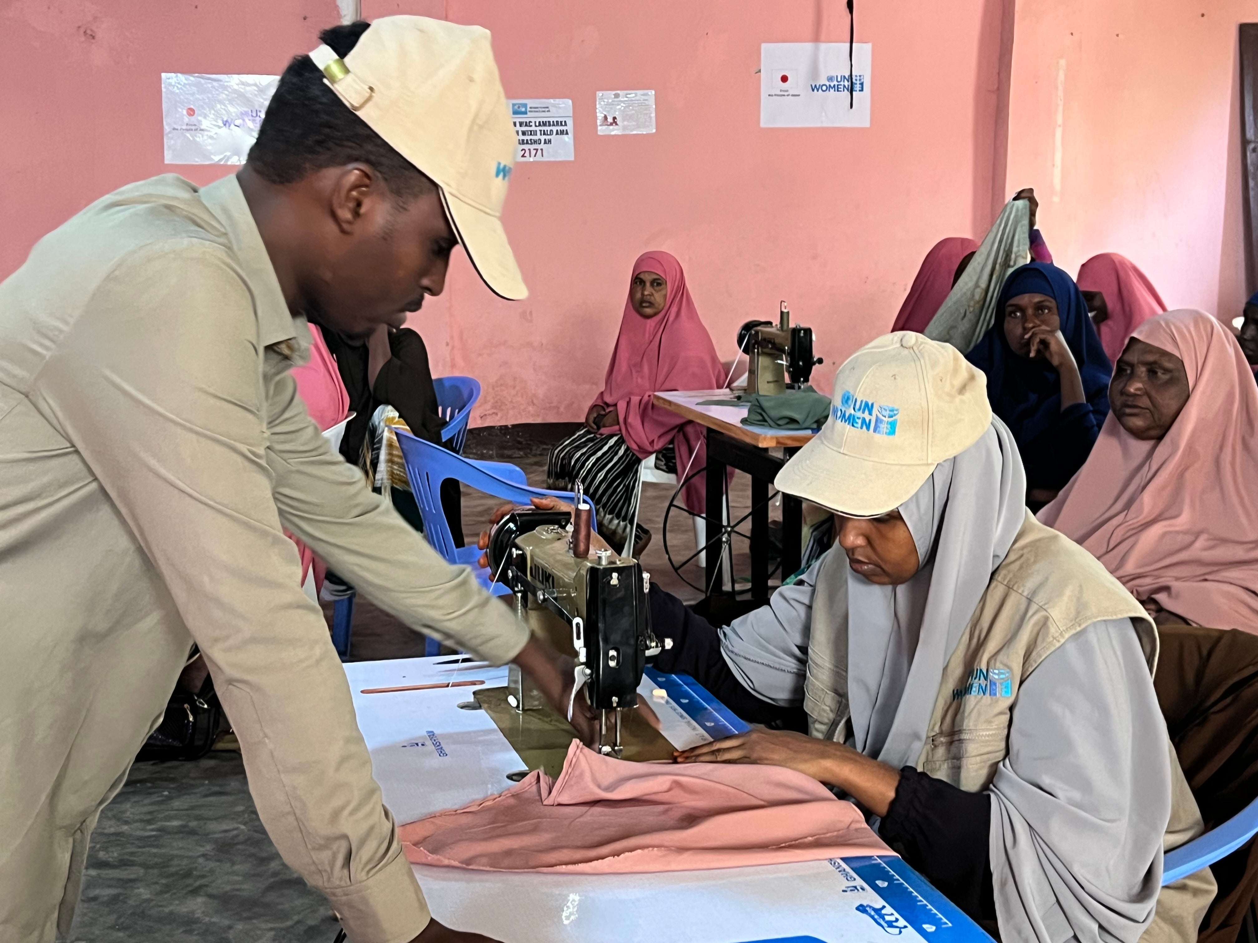 Rahma  (seated) during a training session on tailoring (Photo: courtesy of NAPAD) 