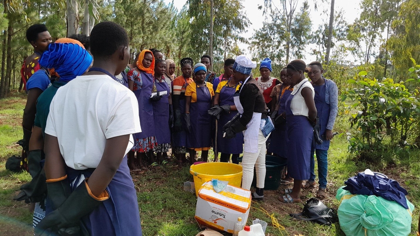 Maria during a tie and dye material making with fellow women entrepreneurs.