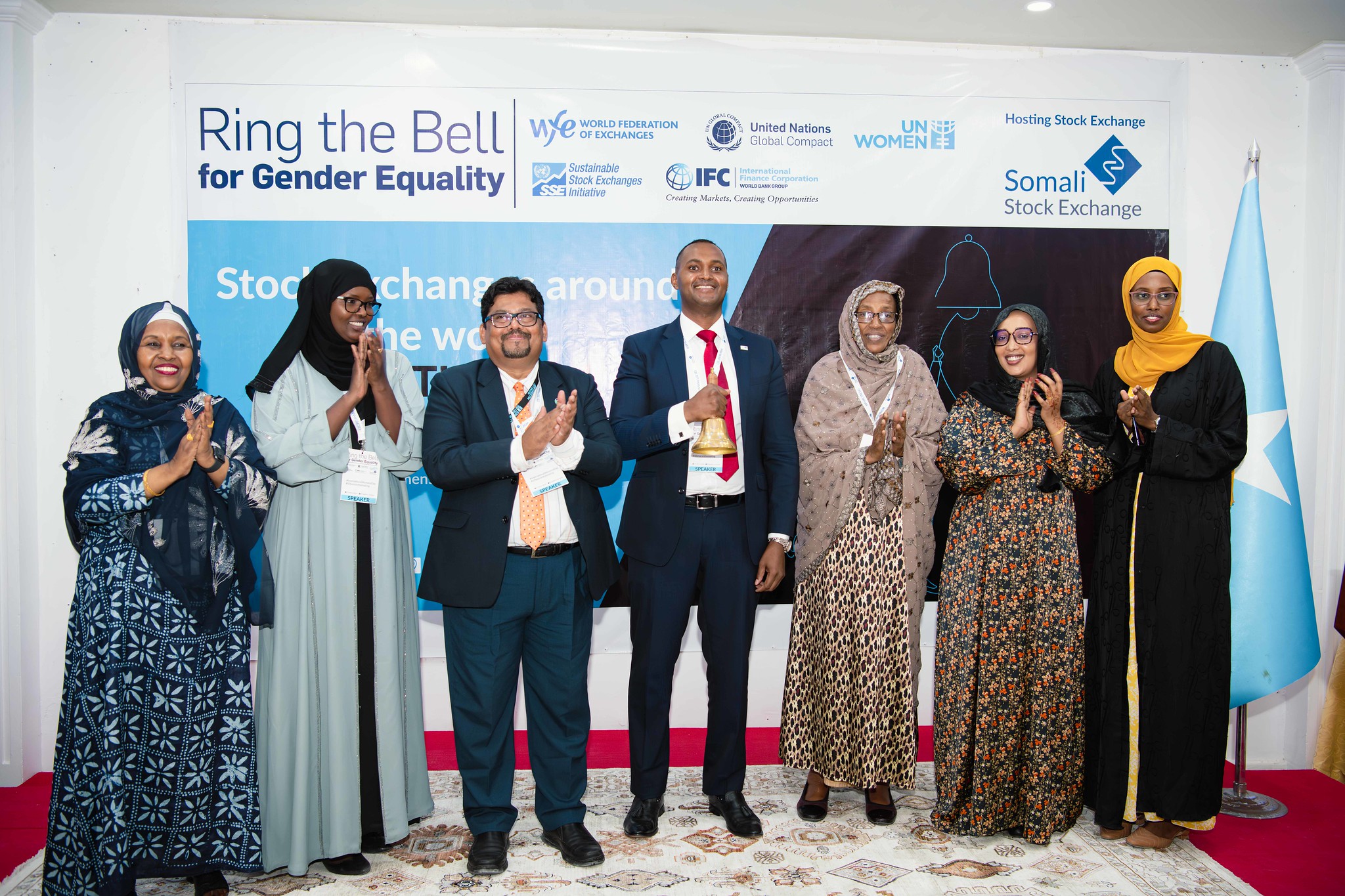  Asha Siyad (second left) Executive director of Somali Women Leadership Initiative and the civil society reference group chair poses for a group photo with participants at the Ring the Bell event. Photo: UNSOM SCPAG/Muktar 