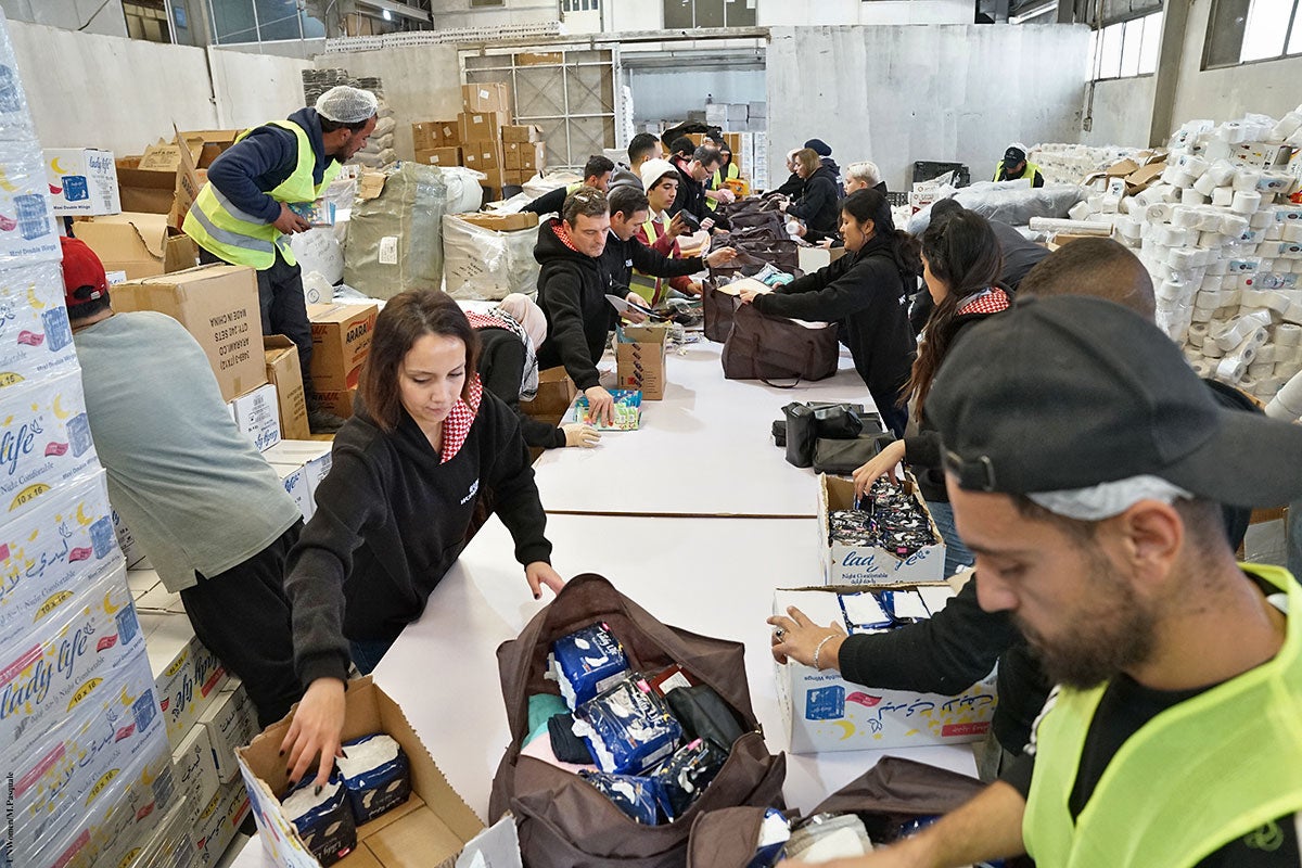 UN Women joins the Jordan Hashemite Charity Organization to pack thousands of dignity kits, including menstrual hygiene products to send to Gaza in February 2024. The war in Gaza has left Palestinian women and girls in devastation, without access to adequate food, water, sanitation, and hygiene, impacting their mental and physical well-being and dignity. Photos: UN Women/Michele Pasquale