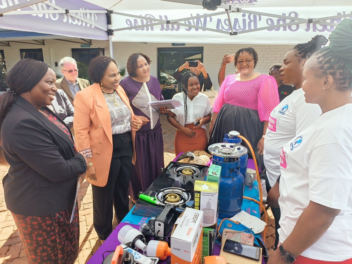 Minister of Women Affairs Monica Mustvangwa and UN Women Deputy Country Rep Loveness Makonese taking a tour of Exhibitions at the Symposium . Photo: UN Women/ Innocent Katsande