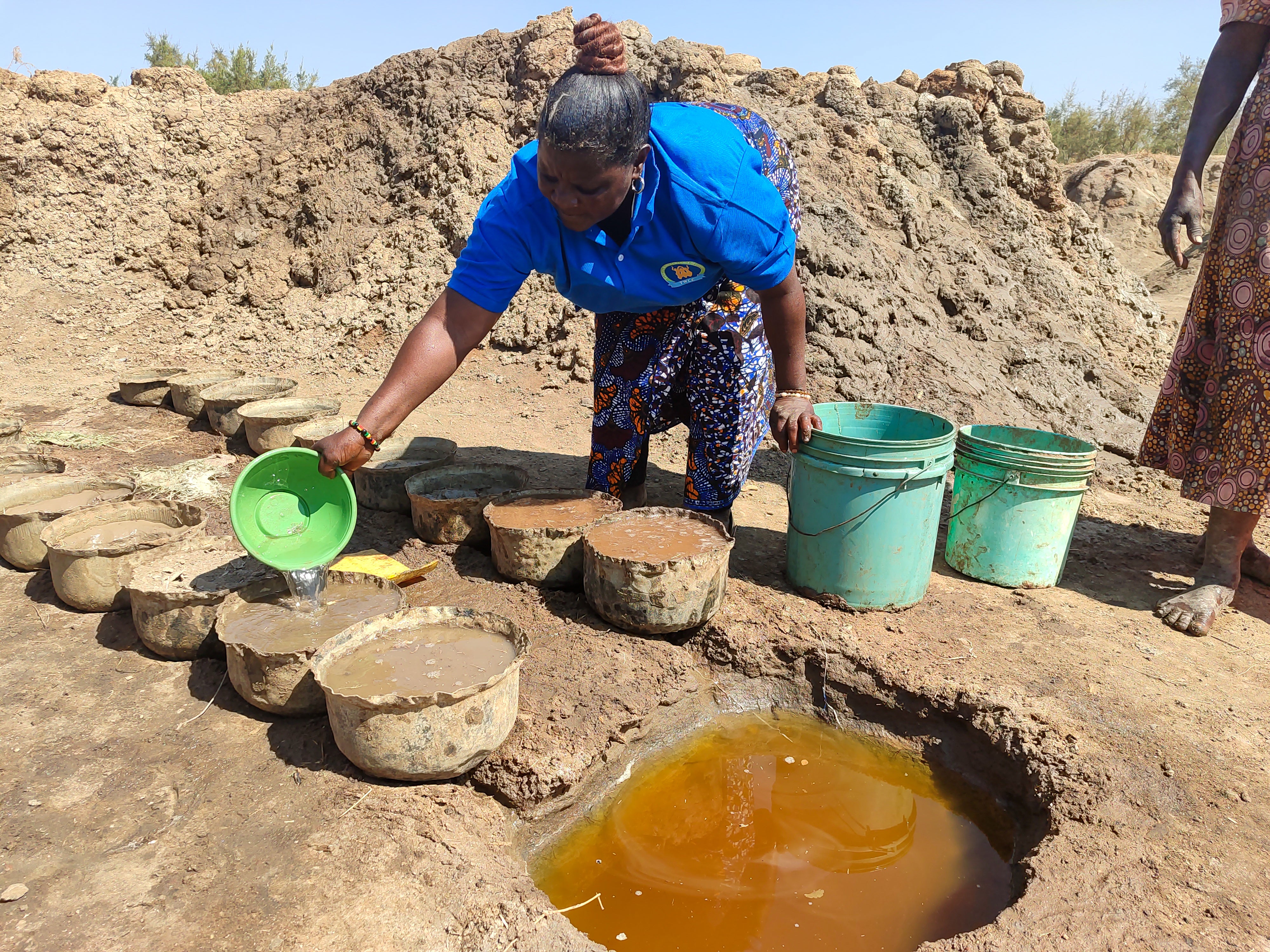 Sarah Daniel Mganga processing rock salt at the Jitegemee group's fields in Chamwino, Tanzania.