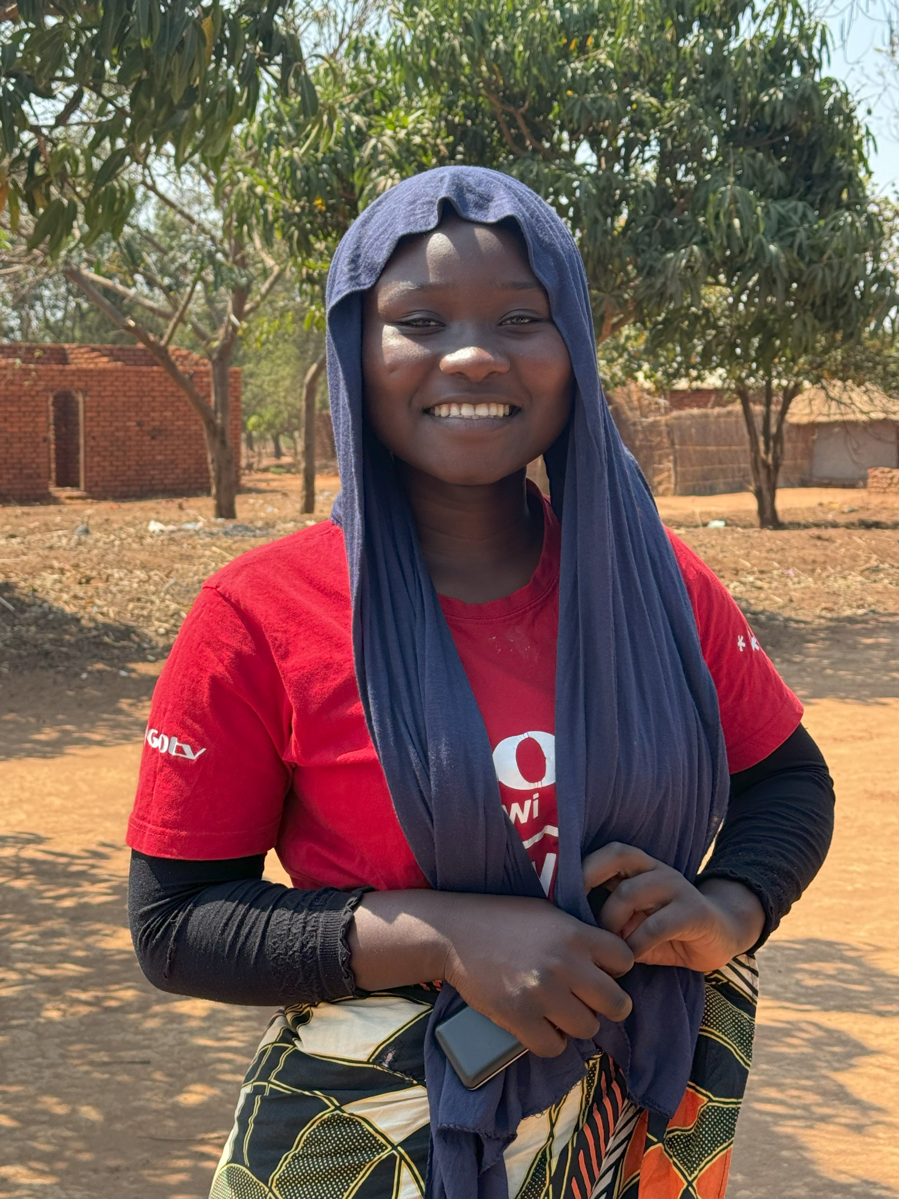 Asiyatu Khefa, 18, shares her journey of returning to school after receiving support from the Women’s Movement for Conflict Prevention and Peacebuilding in Mangochi. Photo: UN Women/Veronica Mukhuna