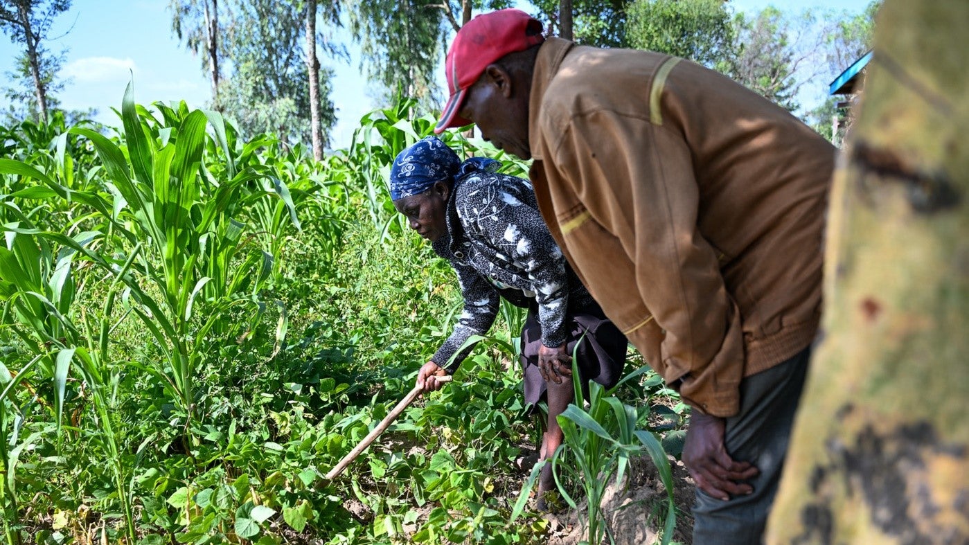 Margaret Wangeci (left) in Laikipia County showcasing her potentially fruitful farm that was once bare. Photo: UN Women/James Ochweri