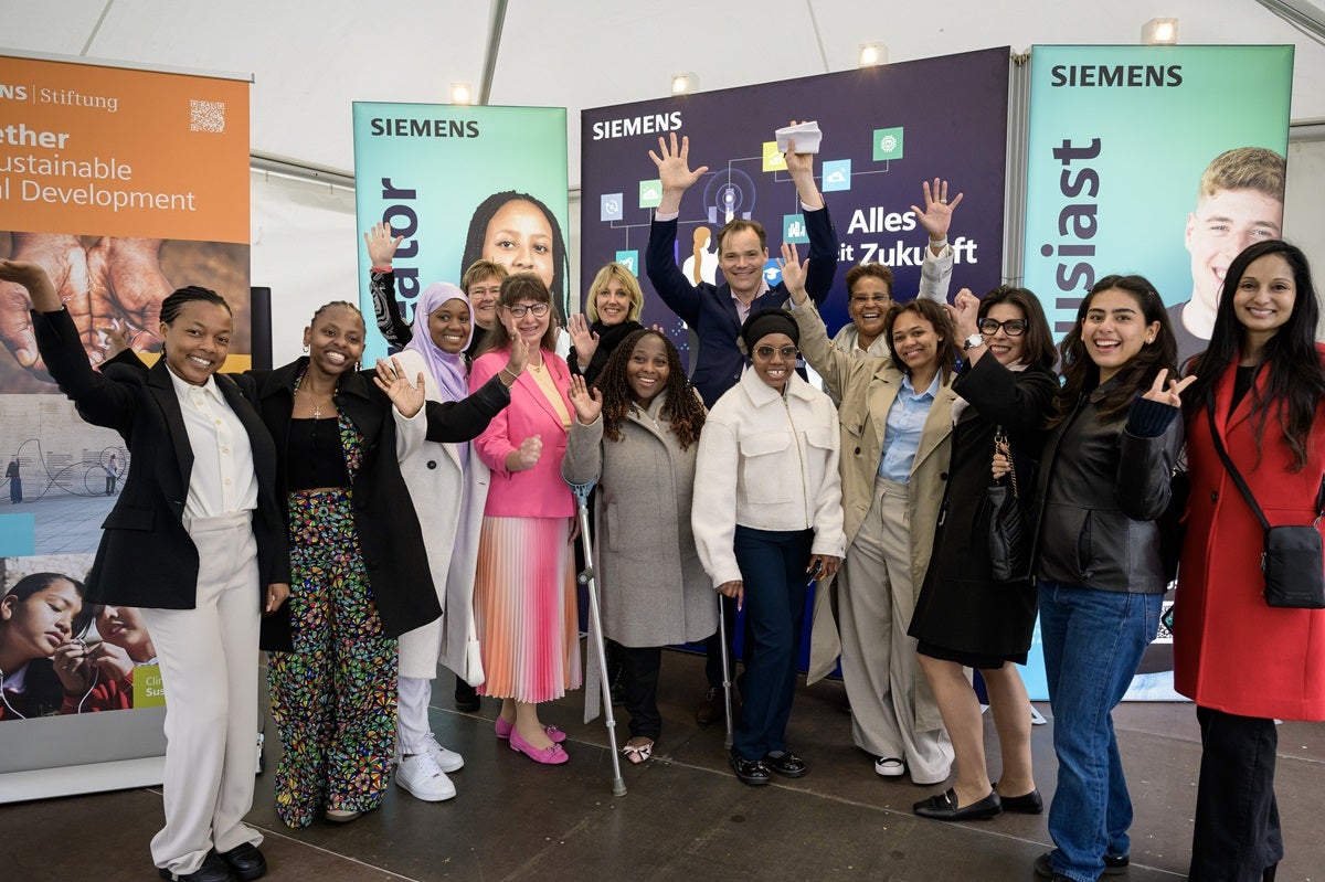 Lucide (furthest left) together with the AGCCI alumni and Siemens Representatives at the Bürgerfest Citizens' Festival.