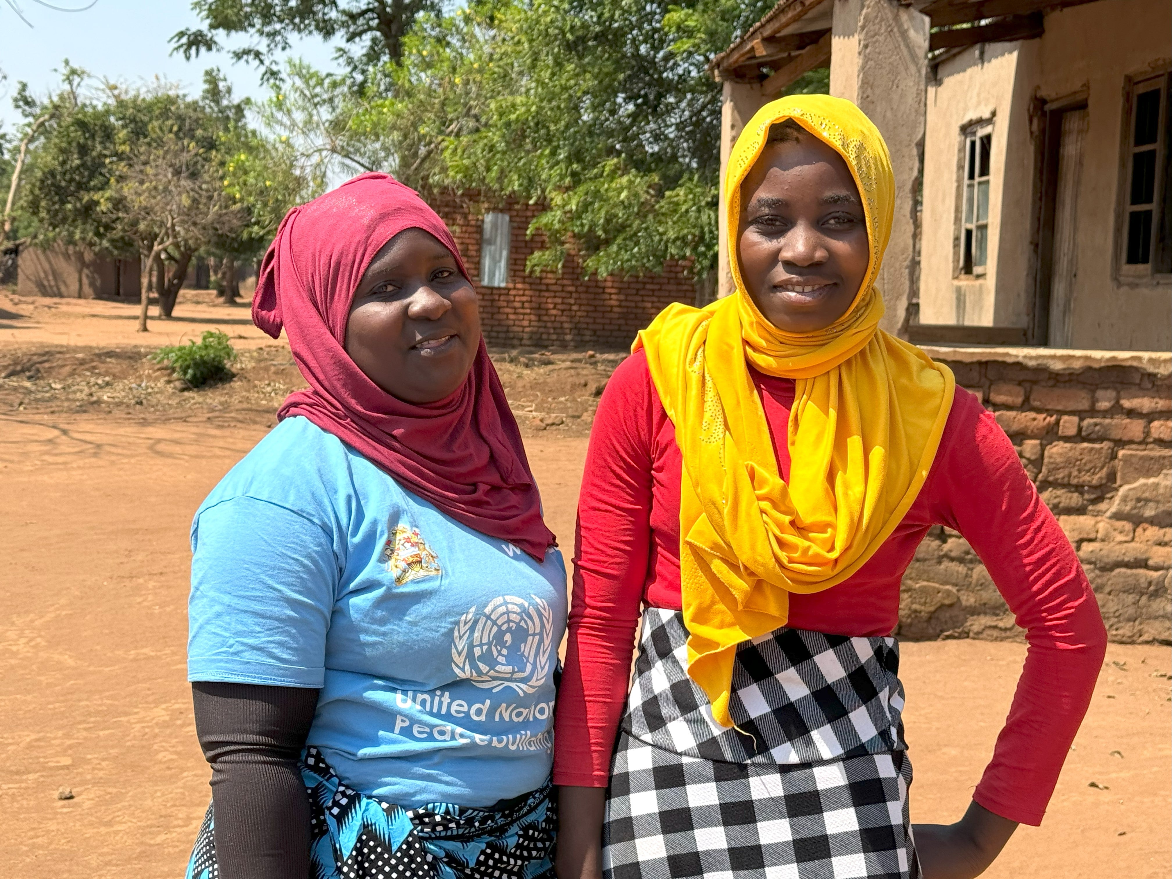 Lukaya Adam (right), with Ratifa Yunusu, a member of the Women’s Movement, during a mentorship visit at her home. Photo: UN Women/Veronica Mukhuna