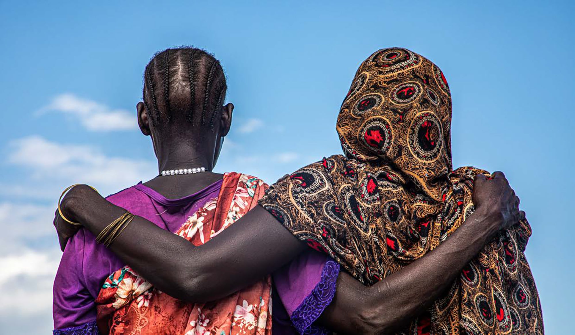 Women are seen at a displaced person's site that helps women in need, including victims of sexual violence, in Bentiu, Sudan.Photo: © OCHA/Alioune Ndiaye