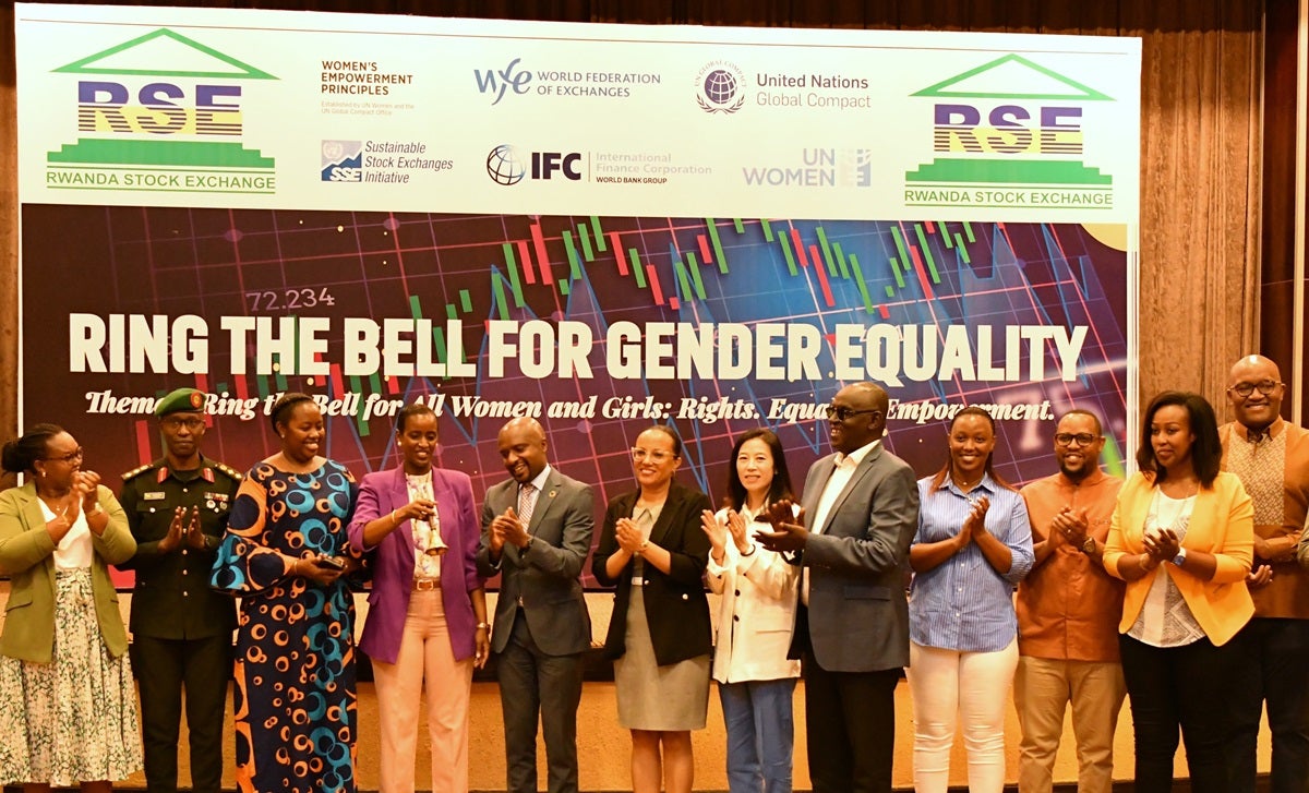 Minister of Sports Nelly Mukazayire (center,in purple) and other dignitaries ringing the bell at the Rwanda Stock Exchange event.