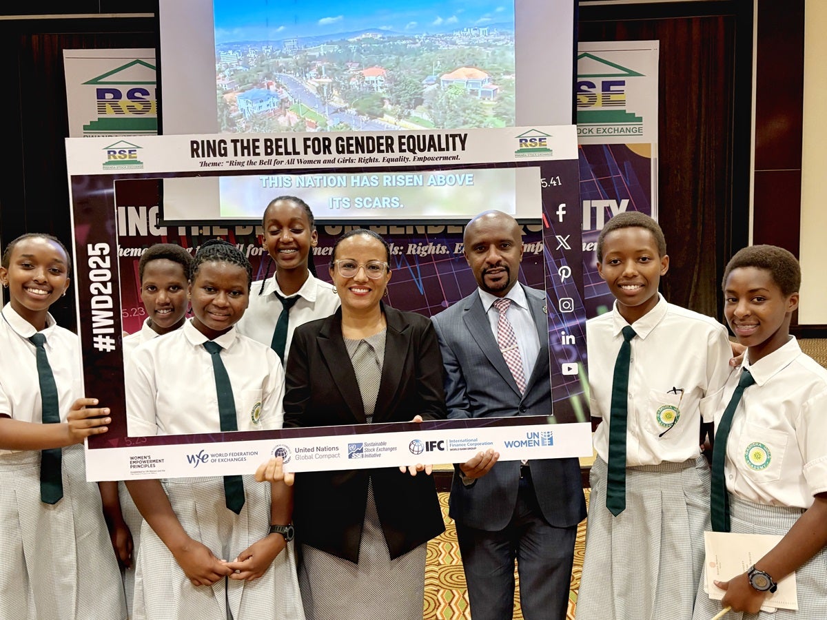Ms. Tikikel Tadele Alemu, Programme Management Specialist and CEO of Rwanda Stock Exchange, Mr Celestin Rwabukumbi with Gashora students at the Ring the Bell event.