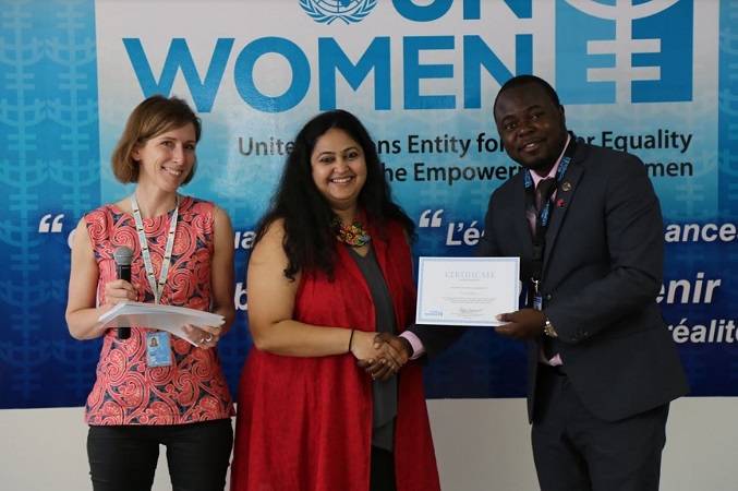 Cecil from Sierra Leone receives his certificate alongside Carlotta and Osika. Photo: UN Women/ Keneddy Okoth