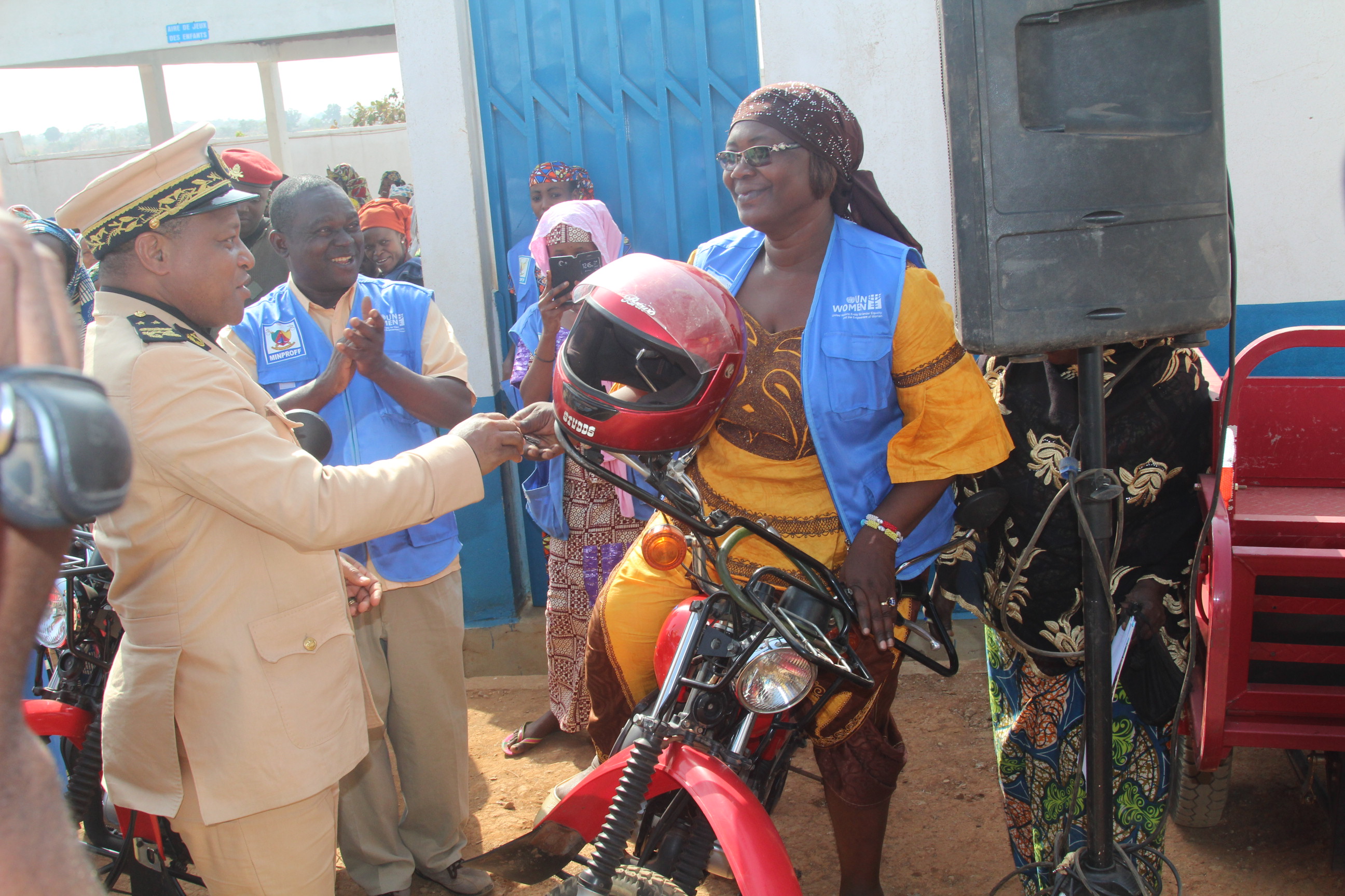 Worker at WCS receives keys of Motocycle from Divisional Officer with joy. Photo credit: Fajong Joseph-UN Women