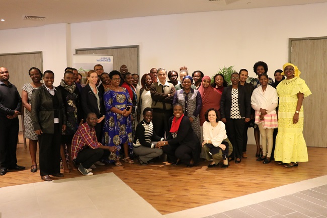Participants in the Humanitarian Action Training of Trainers pose for a photo with UN Women Regional Director, Izeduwa Derex-Briggs (far left). Photo: UN Women/ Faith Bwibo