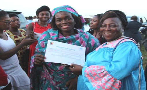 A participant receiving her attestation from the hands of  Honorable Lydienne Epoube. Photo credit: Emeline  Evina/HeForShe Volunteer/UN Women Cameroon