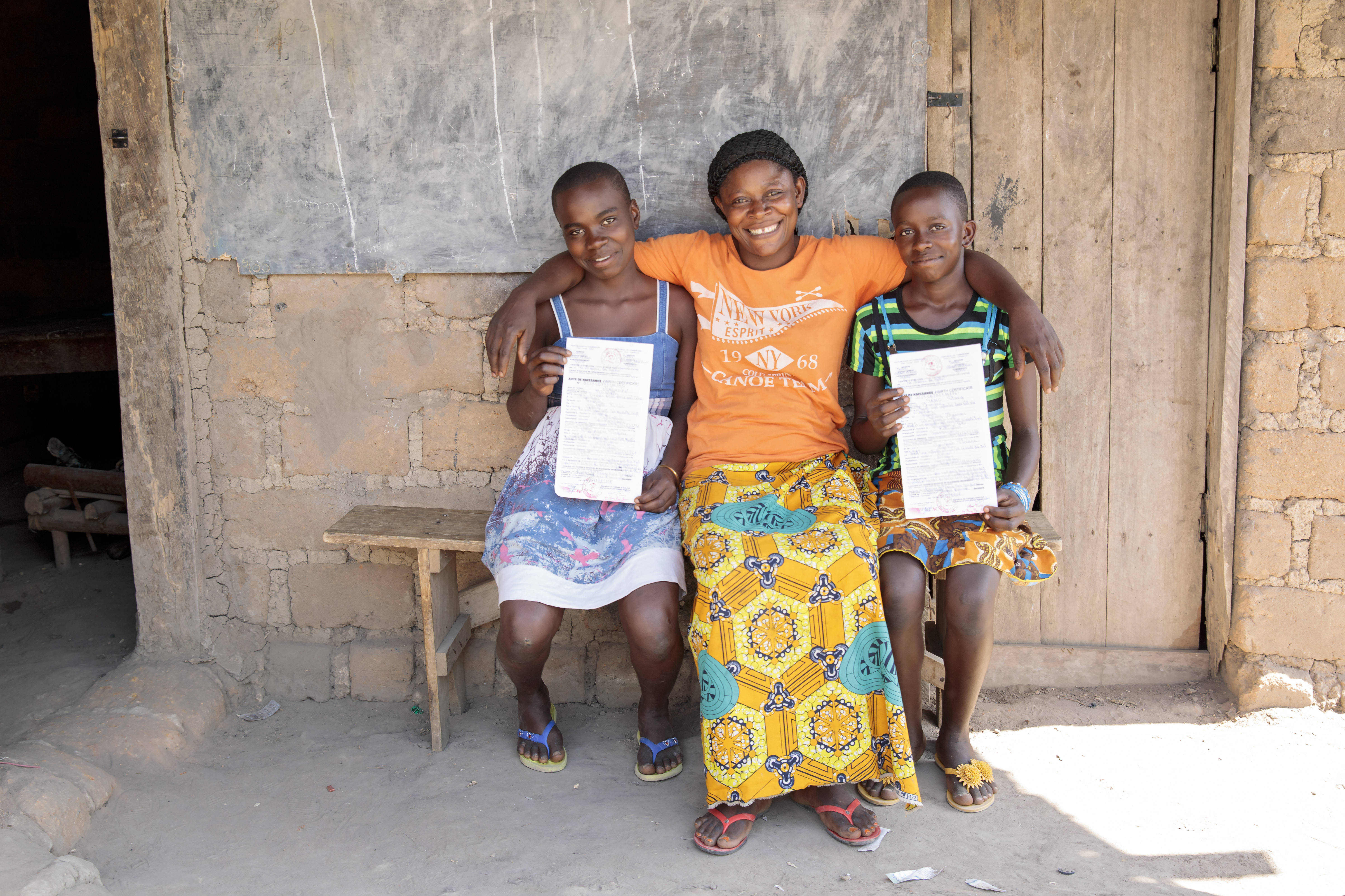 Beneficiaries of Yoko proudly showing off their newly issued birth certificates