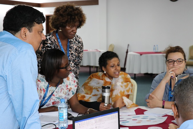 Participants engage in a group activity during a session on Gender Parity. Photo: UN Women/ Faith Bwibo