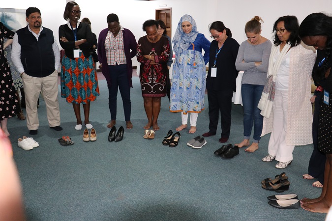 Purna Sen from UN Women (second from right)  leads participants in a group activity. Photo: UN Women/ Faith Bwibo