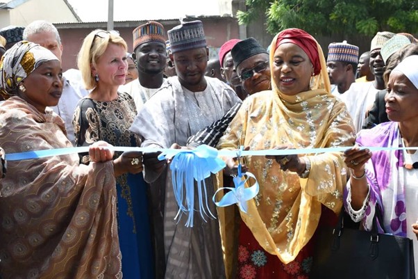 UN Women Deputy Executive Director Åsa Regnér, UN Women Nigeria Country Representative, Comfort Lamptey, Hon. Zuwaira Gambo Commissioner of Borno State Ministry of Women Affairs and Social Development and other key officials of the Borno State Government cutting the ribbon during the commissioning of a rice milling machine in Jere LGA of Borno State. 