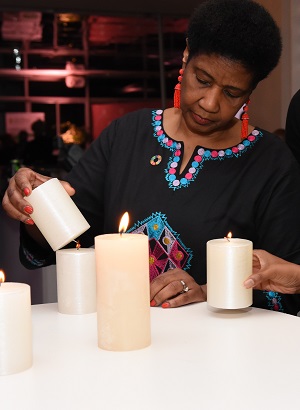 UN Women Executive Director Phumzile Mlambo Ngcuka lights a candle in rememberance of victims and survivors of GBVF. Photo: UN Women