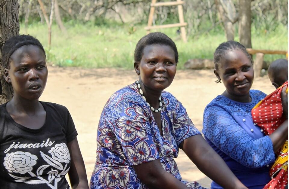 Rebecca Chepkateke (centre) sits with women from Ashiokanian village. Photo_ NAWOU_Fionah Barbra