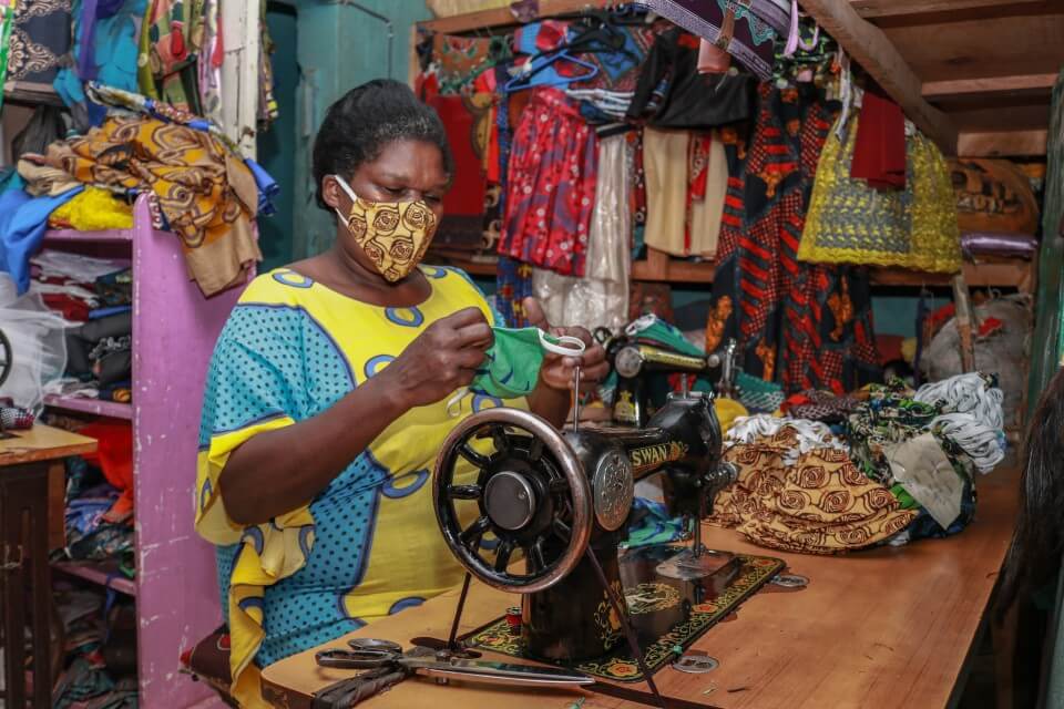 A tailor making masks in Kawangware. 110 women were trained on mask production in 2020. 