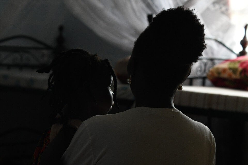 Rachel with one of the younger residents at the GBV Shelter. Photo: UN Women/Eva Sibanda.