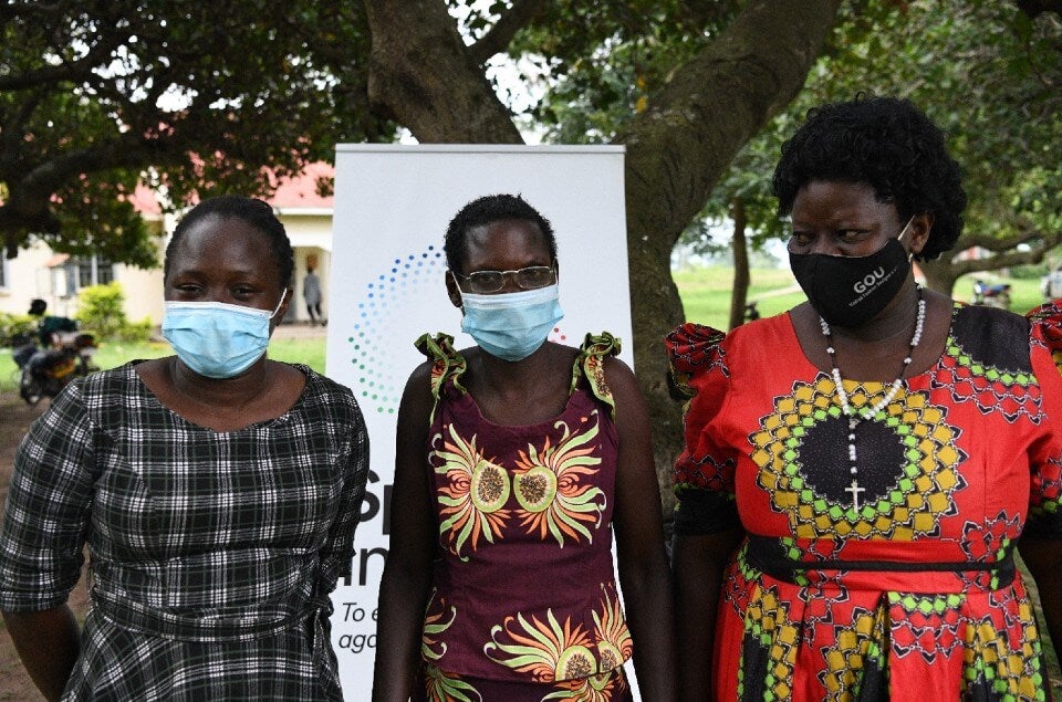 Evelyn (UWONET), Mary Amolo (UWONET beneficiary) and UWONET Community Activist based in Tororo District, Faith Nora (L - R) Photo: UN Women/Eva Sibanda