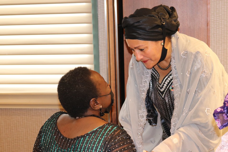 Amina Mohammed shares a moment with Lois Auta of the Network of Disabled Women